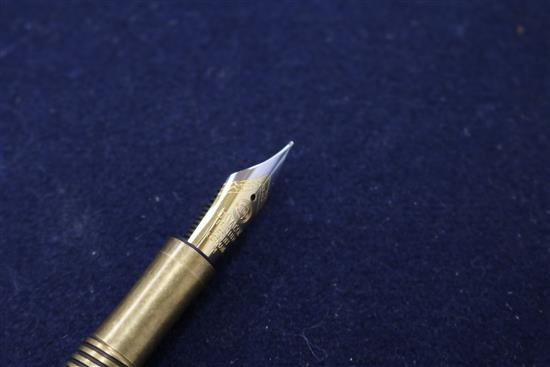 Three ornate fountain pens, cased